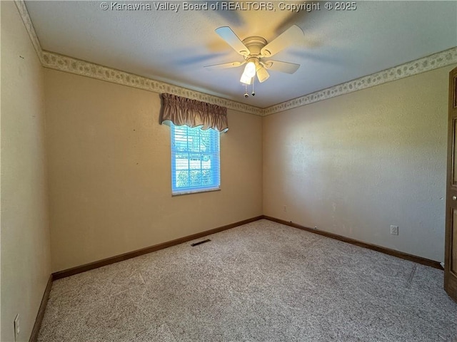 168 Jane Dr, Culloden, WV 25510 - spare room featuring visible vents, a ceiling fan, baseboards, and carpet floors