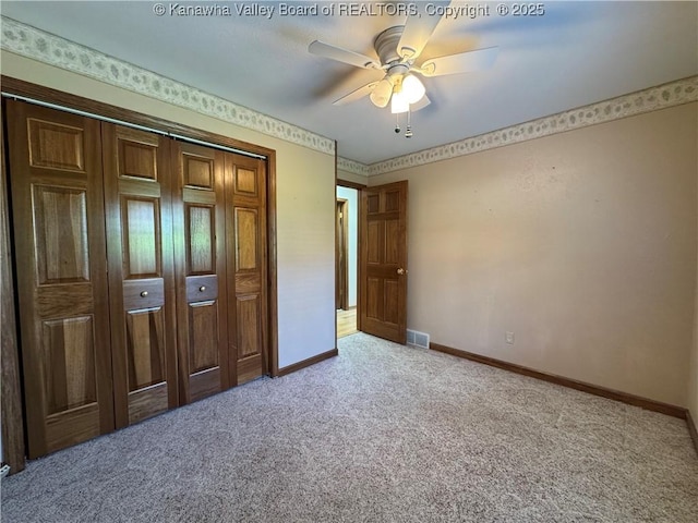 168 Jane Dr, Culloden, WV 25510 - unfurnished bedroom with a closet, light carpet, ceiling fan, baseboards, and visible vents
