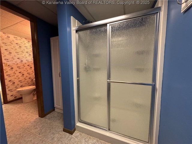 168 Jane Dr, Culloden, WV 25510 - bathroom featuring toilet, tile patterned flooring, and a stall shower