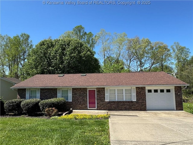 168 Jane Dr, Culloden, WV 25510 - single story home with a front lawn, concrete driveway, brick siding, and an attached garage