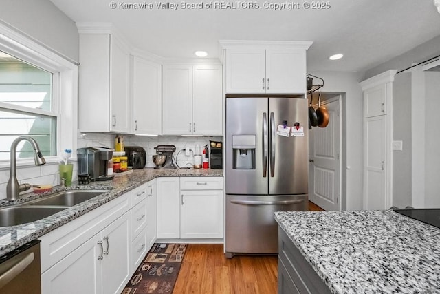 901 Evanwood Rd, Charleston, WV 25314 - kitchen featuring stainless steel appliances, a sink, white cabinetry, light wood finished floors, and recessed lighting