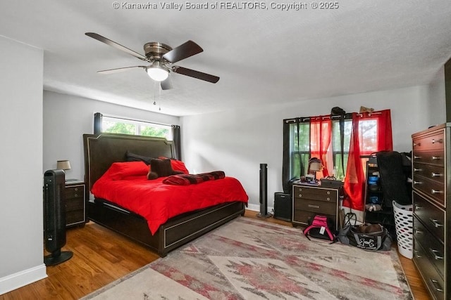 901 Evanwood Rd, Charleston, WV 25314 - bedroom with wood finished floors, baseboards, and ceiling fan