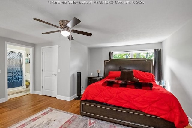901 Evanwood Rd, Charleston, WV 25314 - bedroom with wood finished floors, baseboards, a ceiling fan, and ensuite bath