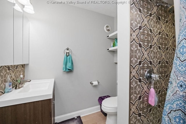 901 Evanwood Rd, Charleston, WV 25314 - full bath with vanity, toilet, a shower with curtain, wood finished floors, and baseboards