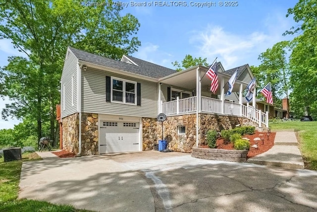 901 Evanwood Rd, Charleston, WV 25314 - view of front of property with stone siding, concrete driveway, an attached garage, and roof with shingles