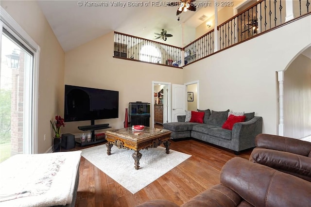 219 Deerhaven Ln, Cross Lanes, WV 25313 - living area with visible vents, arched walkways, wood finished floors, a ceiling fan, and high vaulted ceiling