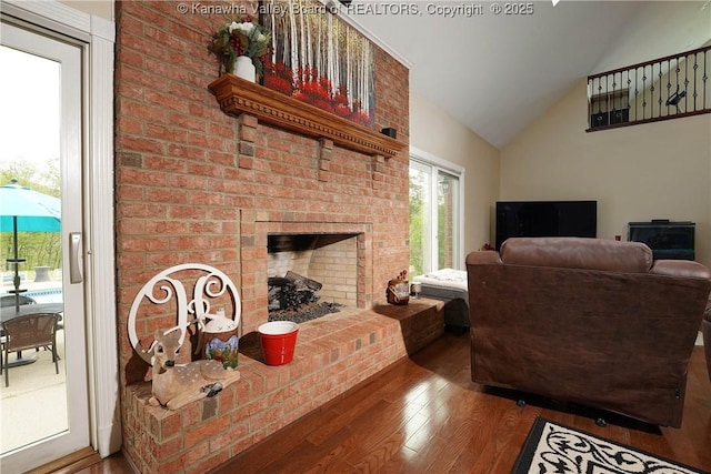 219 Deerhaven Ln, Cross Lanes, WV 25313 - living room with a brick fireplace, high vaulted ceiling, and wood finished floors