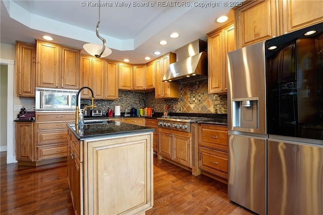 219 Deerhaven Ln, Cross Lanes, WV 25313 - kitchen featuring wall chimney exhaust hood, recessed lighting, appliances with stainless steel finishes, and tasteful backsplash