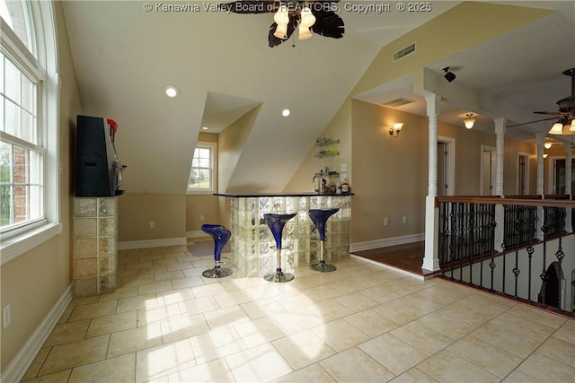 219 Deerhaven Ln, Cross Lanes, WV 25313 - interior space with lofted ceiling, an upstairs landing, visible vents, baseboards, and ornate columns