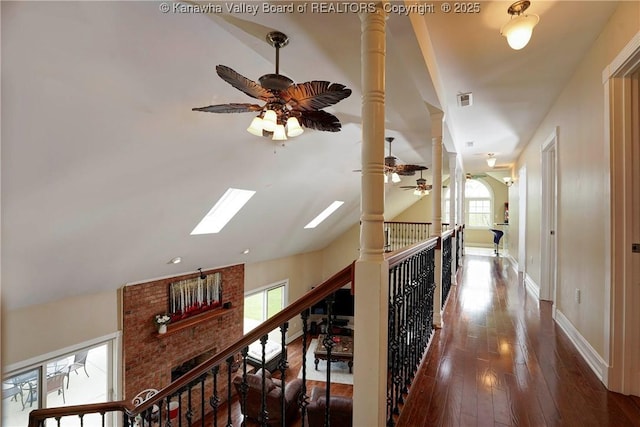 219 Deerhaven Ln, Cross Lanes, WV 25313 - corridor with visible vents, vaulted ceiling with skylight, hardwood / wood-style flooring, and plenty of natural light