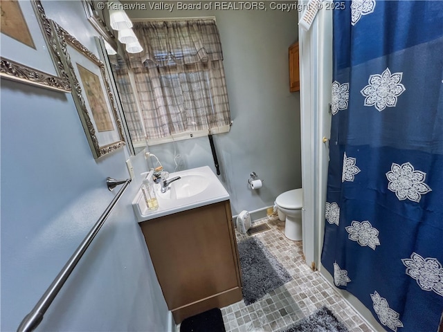 full bath featuring toilet, baseboards, tile patterned flooring, and vanity