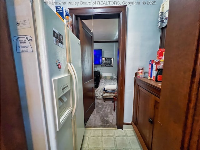 hallway with light colored carpet
