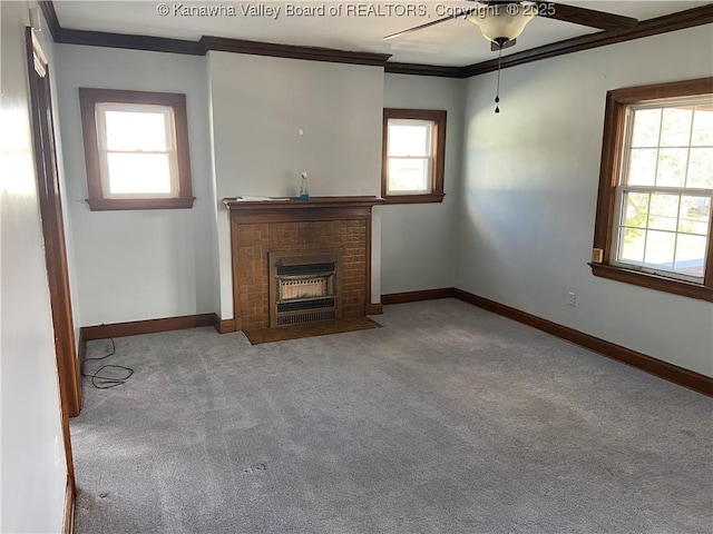 unfurnished living room featuring carpet flooring, a ceiling fan, baseboards, and ornamental molding