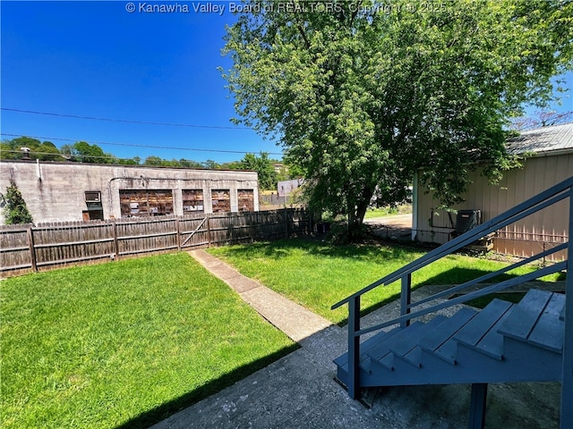 view of yard with a fenced backyard