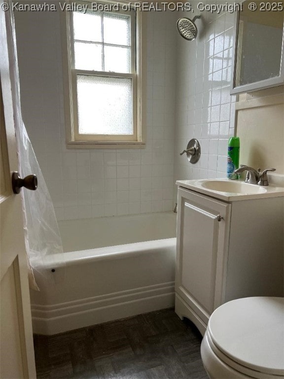 bathroom with shower / bath combo with shower curtain, toilet, and vanity