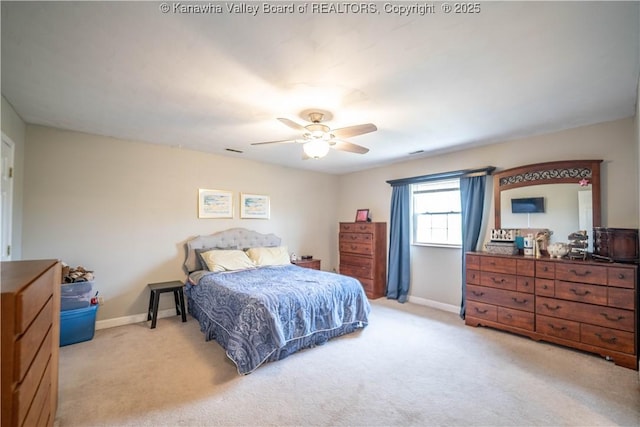 bedroom featuring light carpet, baseboards, and ceiling fan