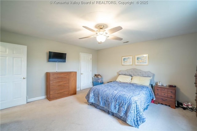 bedroom featuring carpet flooring, a ceiling fan, and baseboards