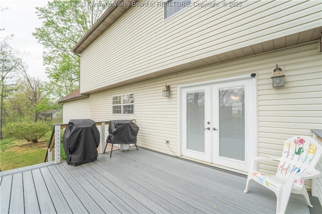 wooden terrace featuring french doors and grilling area