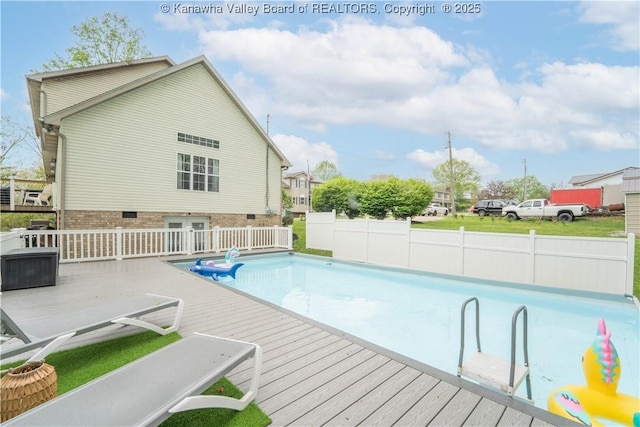 view of pool with a wooden deck