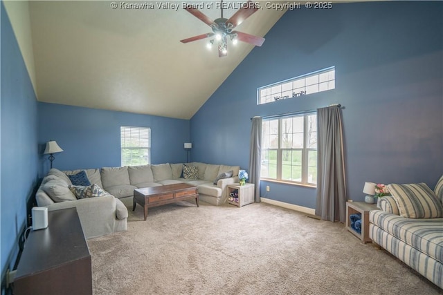 carpeted living room with high vaulted ceiling, a ceiling fan, and baseboards