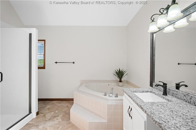 bathroom with vanity, baseboards, lofted ceiling, a bath, and a stall shower