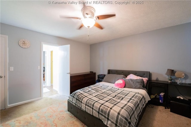 bedroom featuring light colored carpet and ceiling fan
