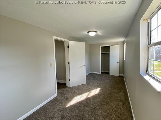 104, 102 1st St, Dunbar, WV 25064 - unfurnished bedroom with baseboards, carpet, and a closet