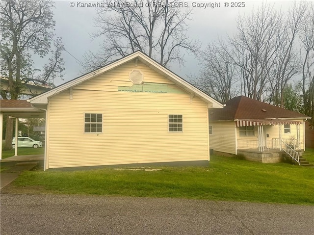 104, 102 1st St, Dunbar, WV 25064 - view of home's exterior featuring a lawn