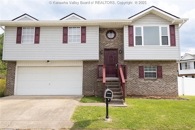 raised ranch featuring brick siding, driveway, a front lawn, and a garage