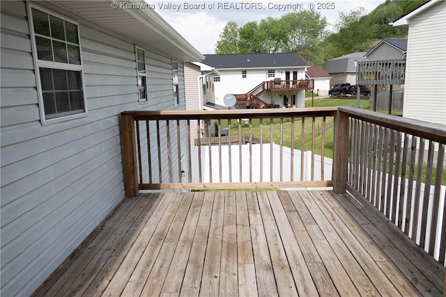 wooden deck with a residential view
