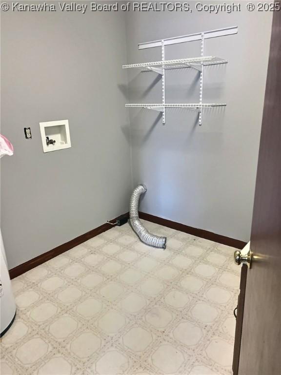 laundry area featuring laundry area, hookup for a washing machine, and baseboards