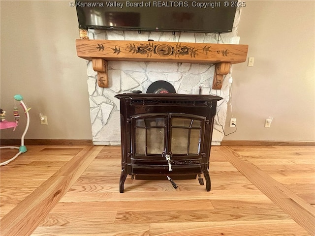interior details with baseboards and wood finished floors