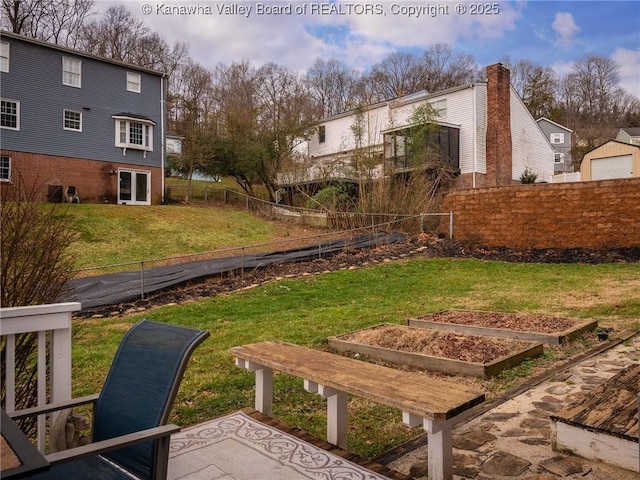 5339 Pioneer Dr, Cross Lanes, WV 25313 - view of yard with fence and a vegetable garden
