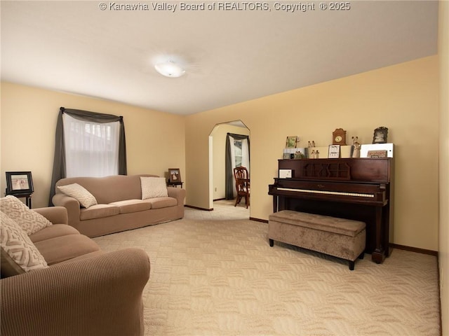 5339 Pioneer Dr, Cross Lanes, WV 25313 - living area featuring arched walkways, baseboards, and light carpet