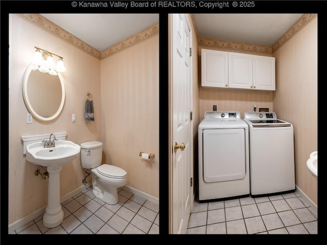 5339 Pioneer Dr, Cross Lanes, WV 25313 - bathroom featuring independent washer and dryer, toilet, tile patterned floors, and baseboards