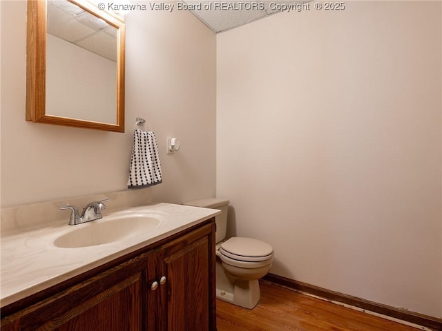5339 Pioneer Dr, Cross Lanes, WV 25313 - bathroom with vanity, toilet, and wood finished floors