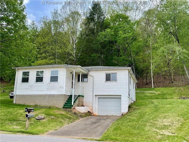 view of front of property featuring stairway, an attached garage, a front lawn, and aphalt driveway