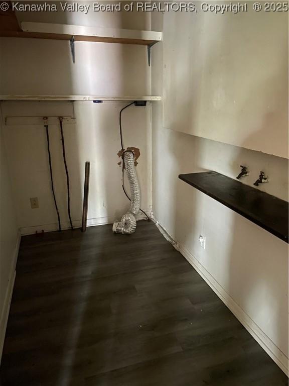 washroom with laundry area, baseboards, dark wood-type flooring, and hookup for a washing machine