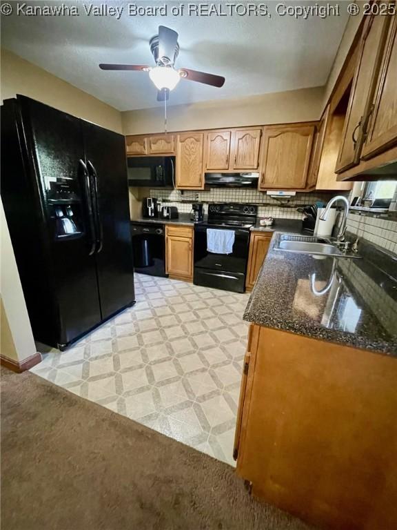 kitchen with ceiling fan, a sink, backsplash, under cabinet range hood, and black appliances
