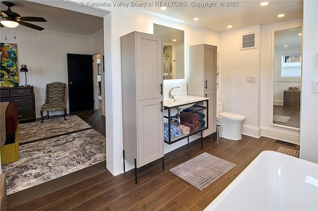bathroom with visible vents, wood finished floors, toilet, recessed lighting, and a ceiling fan