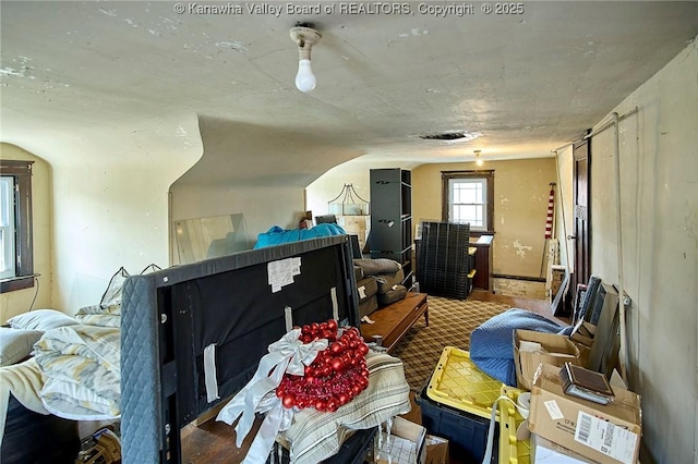 interior space featuring vaulted ceiling and wood finished floors