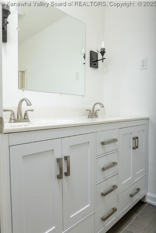 bathroom with double vanity and a sink