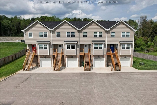 9073 Teays Valley Rd, Scott Depot, WV 25560 - view of front of home with stairs, brick siding, and driveway