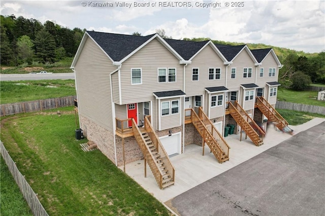 9073 Teays Valley Rd, Scott Depot, WV 25560 - view of front of home with stairway, concrete driveway, an attached garage, and central air condition unit