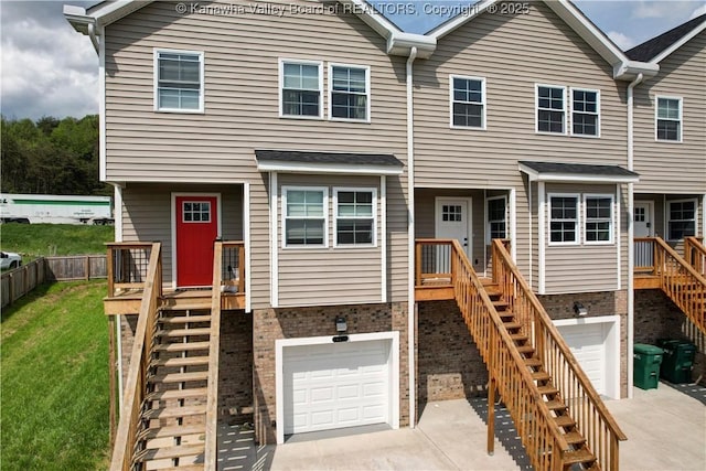 9073 Teays Valley Rd, Scott Depot, WV 25560 - townhome / multi-family property featuring stairs, an attached garage, and concrete driveway