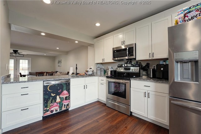 9073 Teays Valley Rd, Scott Depot, WV 25560 - kitchen with stainless steel appliances, light stone counters, white cabinetry, dark wood-type flooring, and recessed lighting