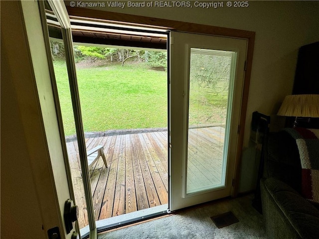 entryway with hardwood / wood-style flooring and visible vents