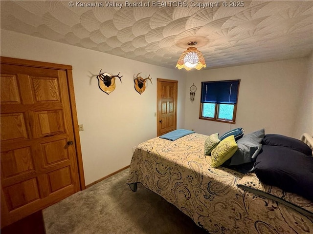 carpeted bedroom with baseboards