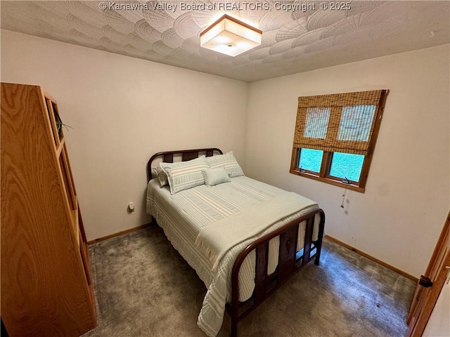 carpeted bedroom with baseboards