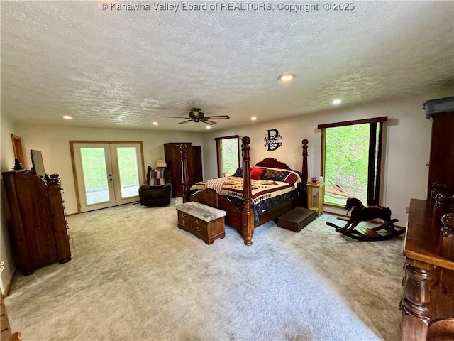 carpeted bedroom with access to exterior, recessed lighting, a textured ceiling, french doors, and a ceiling fan